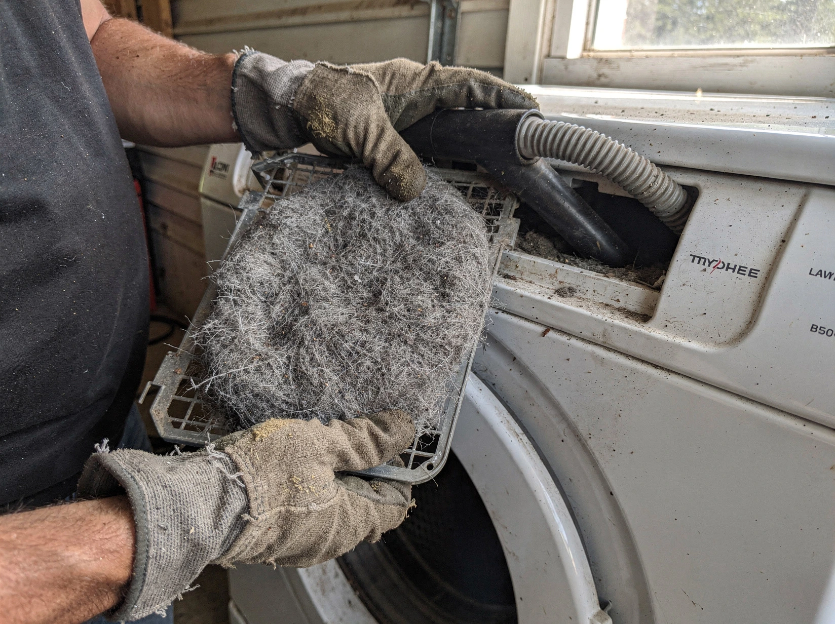Cleaning Dryer Lint Trap in Morgan